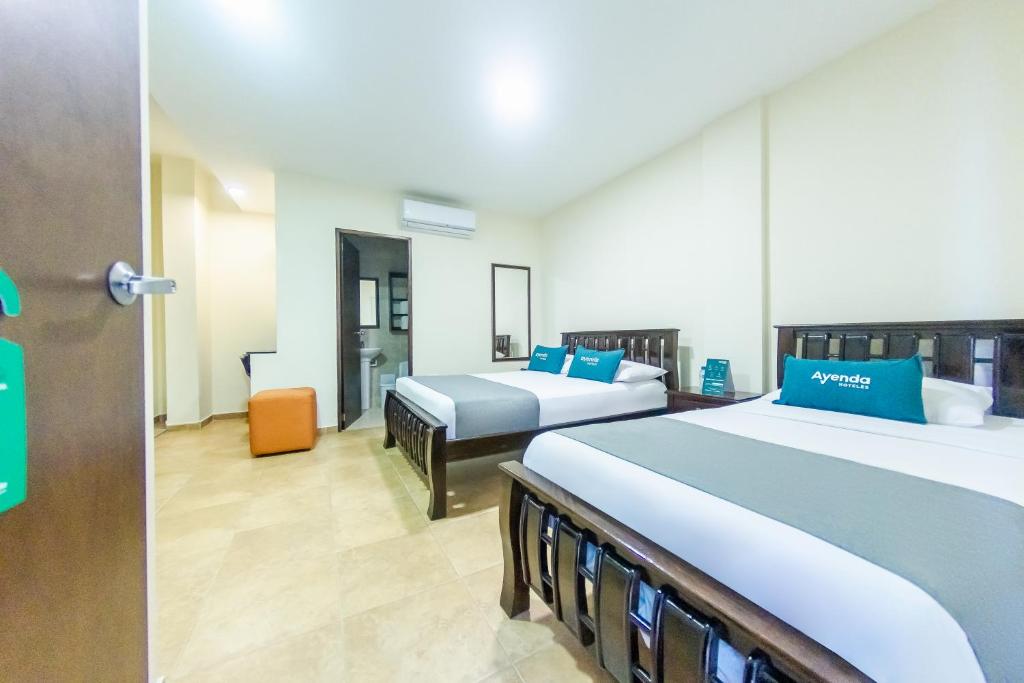 Ένα ή περισσότερα κρεβάτια σε δωμάτιο στο Hotel El Viajero #2