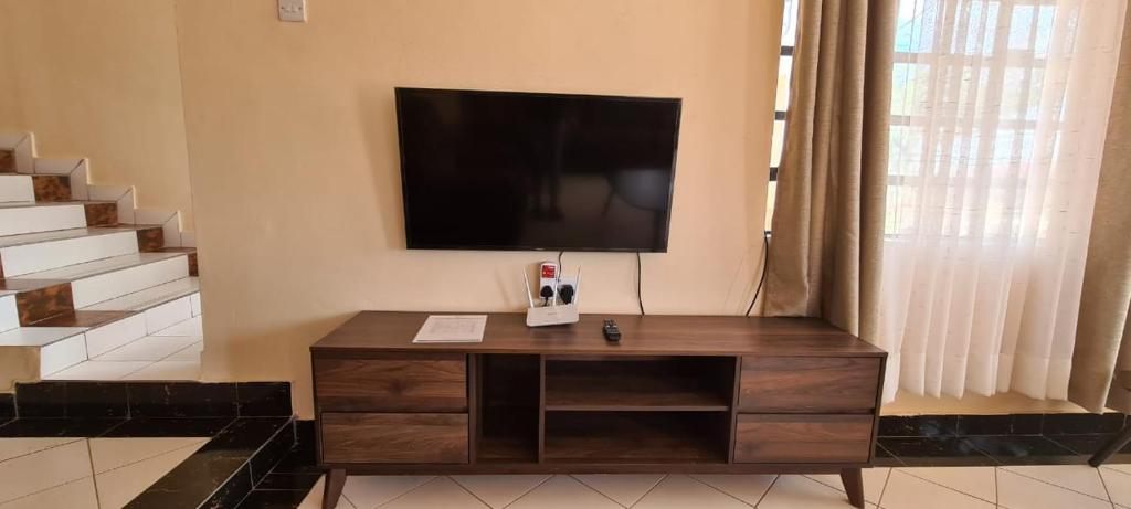 TV a/nebo společenská místnost v ubytování Desa Homes
