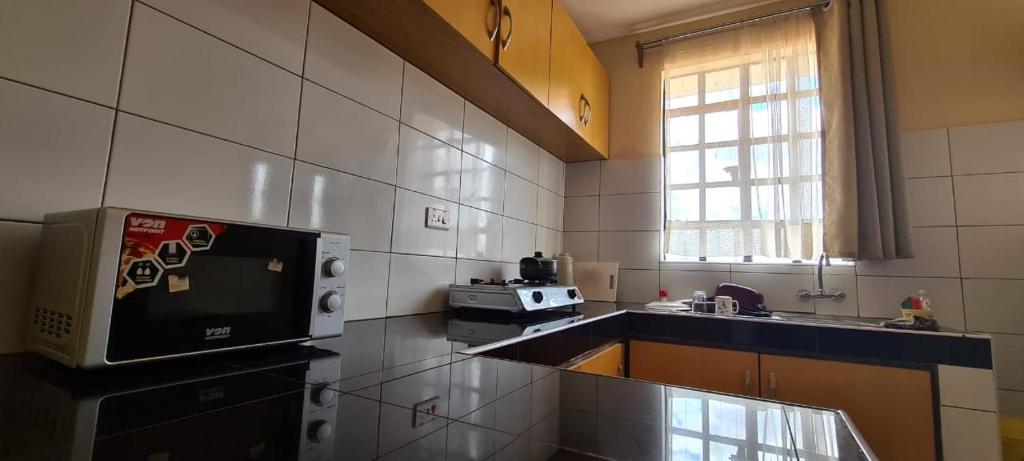 Kuchyň nebo kuchyňský kout v ubytování Desa Homes