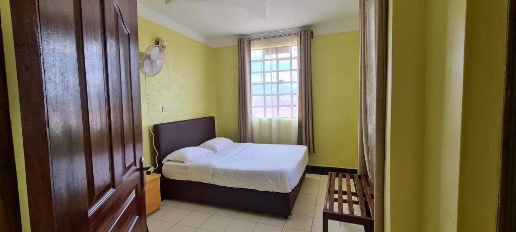 Postel nebo postele na pokoji v ubytování Desa Homes