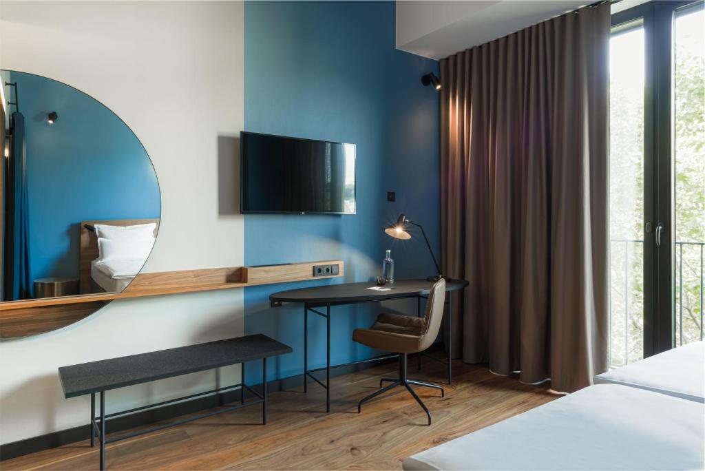 Postel nebo postele na pokoji v ubytování EmiLu Design Hotel