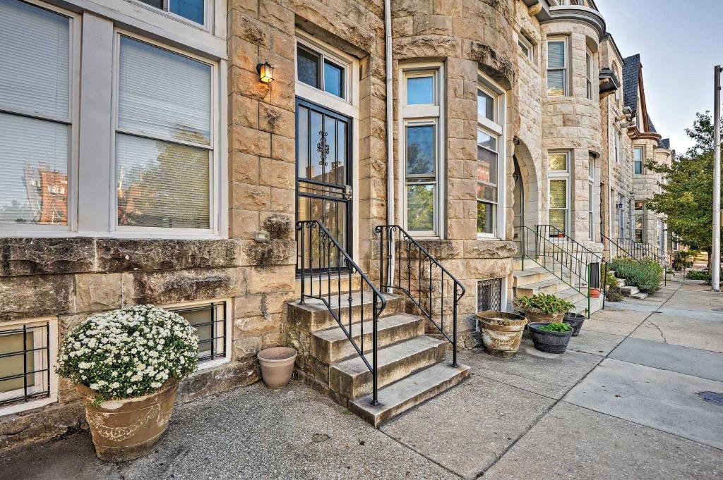 a stone building with stairs in front of it at Chic Baltimore Apartment 2 Mi to Downtown! in Baltimore