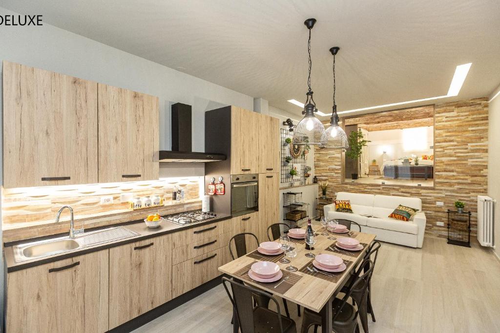 a kitchen and dining room with a table and chairs at Geppi's Apartments in Florence