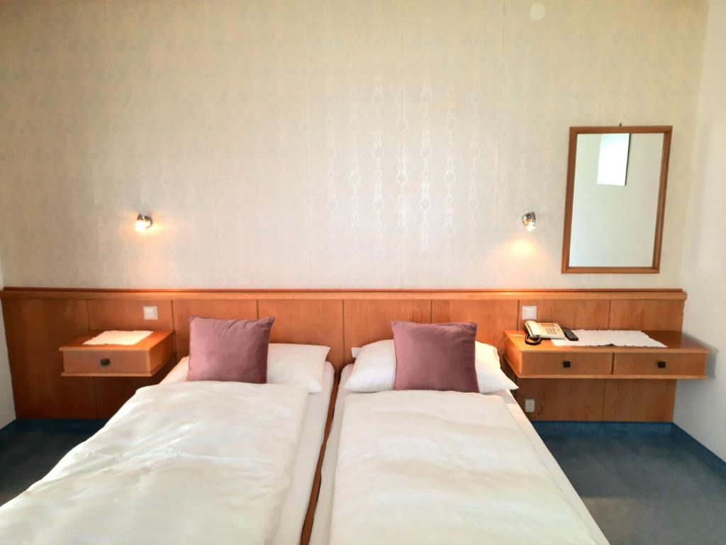 Łóżko lub łóżka w pokoju w obiekcie Apartments Edenhof