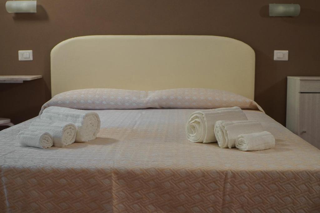 A bed or beds in a room at Dimora Toscana