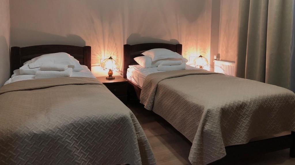 Postel nebo postele na pokoji v ubytování Atlant Hotel