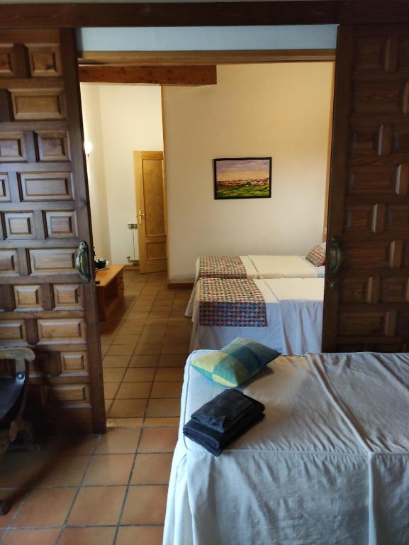 Postel nebo postele na pokoji v ubytování Hostal Escartín
