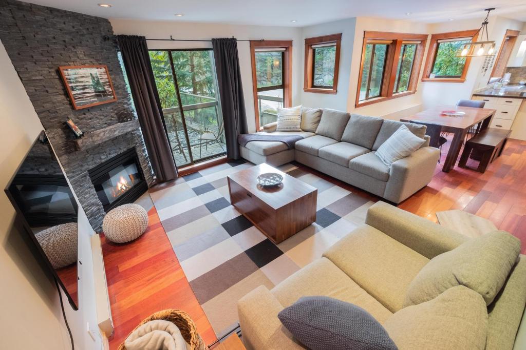 an aerial view of a living room with a fireplace at Greyhawk by Outpost Whistler in Whistler