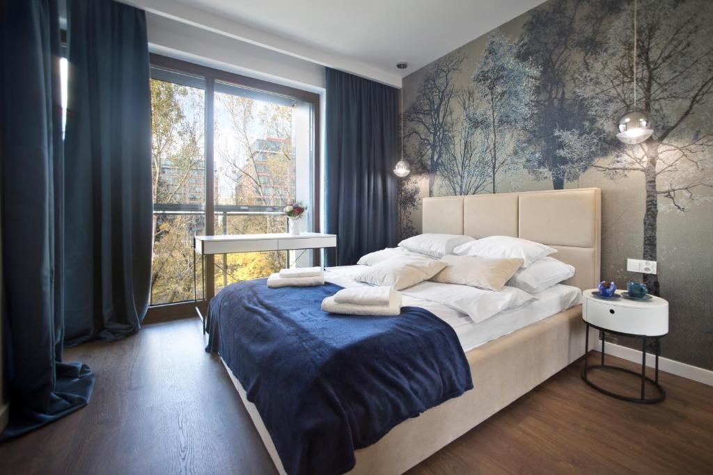 Posteľ alebo postele v izbe v ubytovaní Marina Mokotow P&O Serviced Apartments