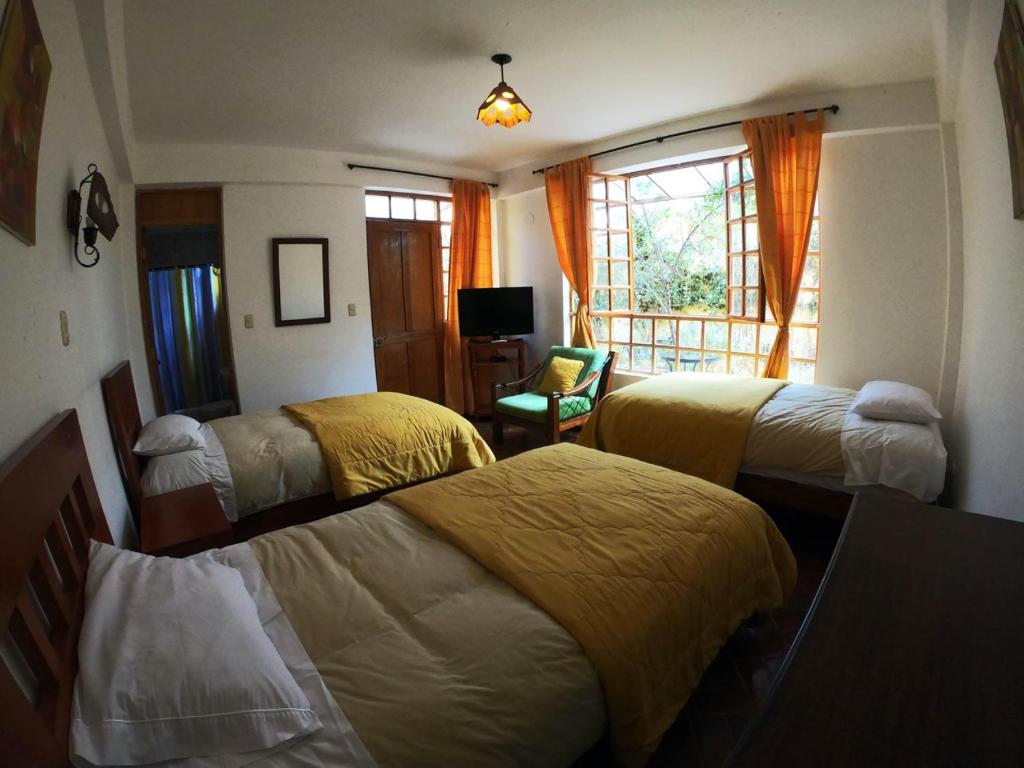 Postel nebo postele na pokoji v ubytování Amaru Valle Hotel