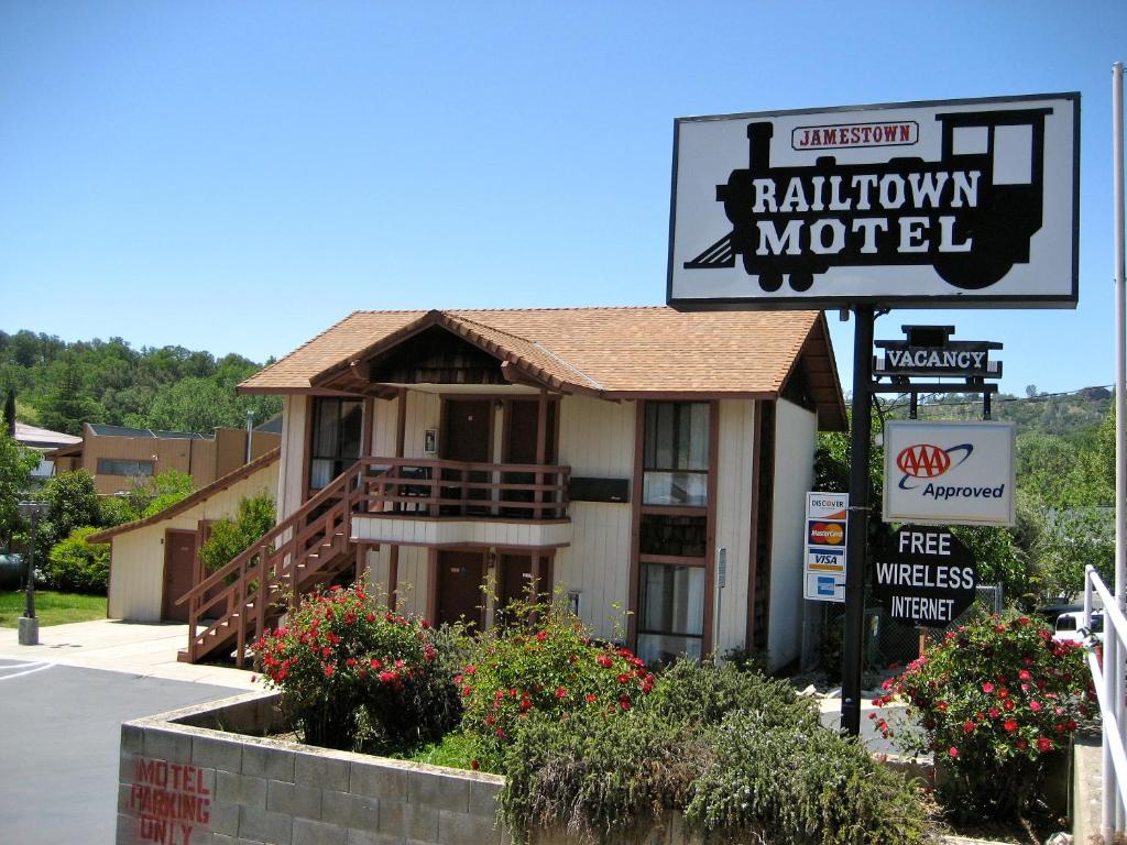 a building with a sign for a motel at Jamestown Railtown Motel in Jamestown