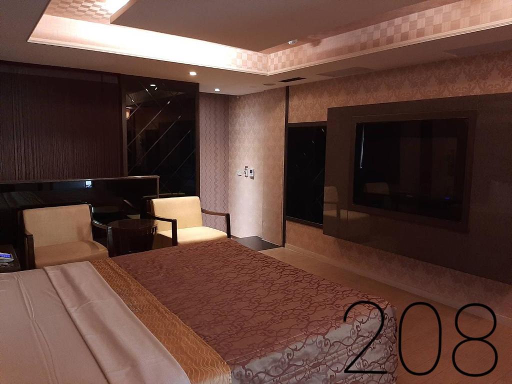 TV a/nebo společenská místnost v ubytování Chateau Motel & Spa (Daliao)