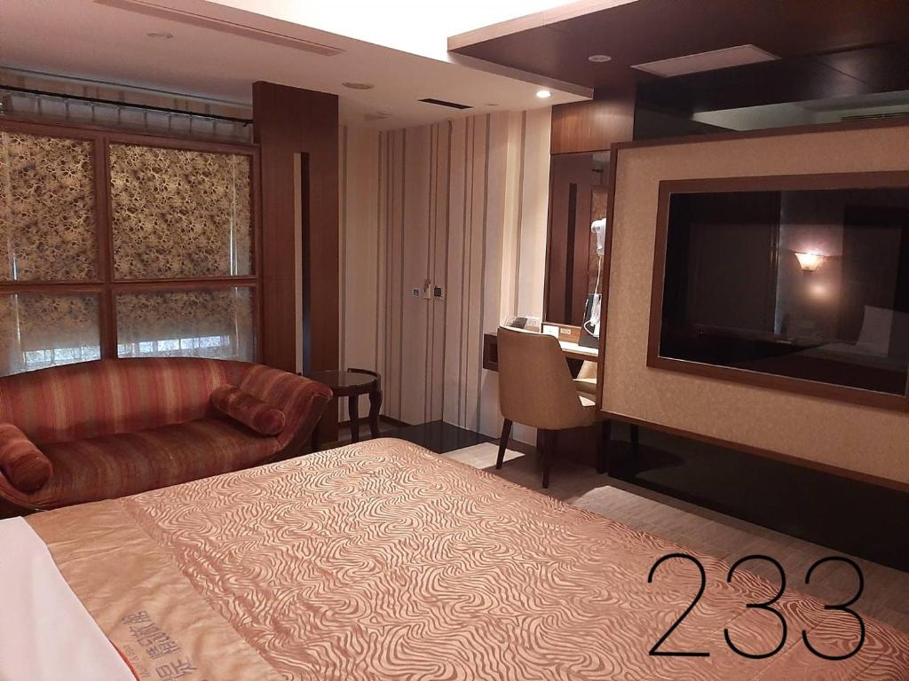 TV a/nebo společenská místnost v ubytování Chateau Motel & Spa (Daliao)