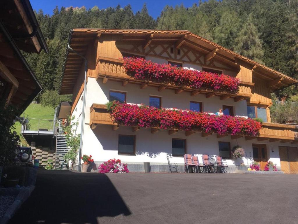 a building with flowers on the side of it at Forsthaus Jehle in Sankt Anton am Arlberg