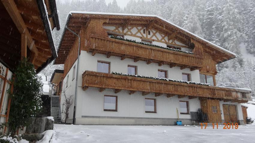 a large building with snow on the side of it at Forsthaus Jehle in Sankt Anton am Arlberg