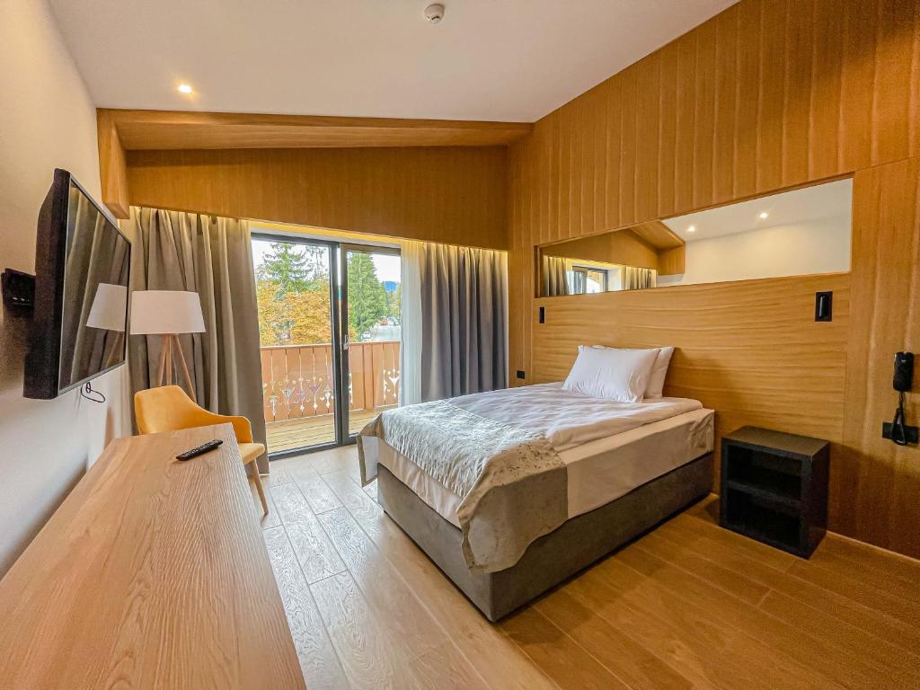 Postel nebo postele na pokoji v ubytování Ursuletul Predeal