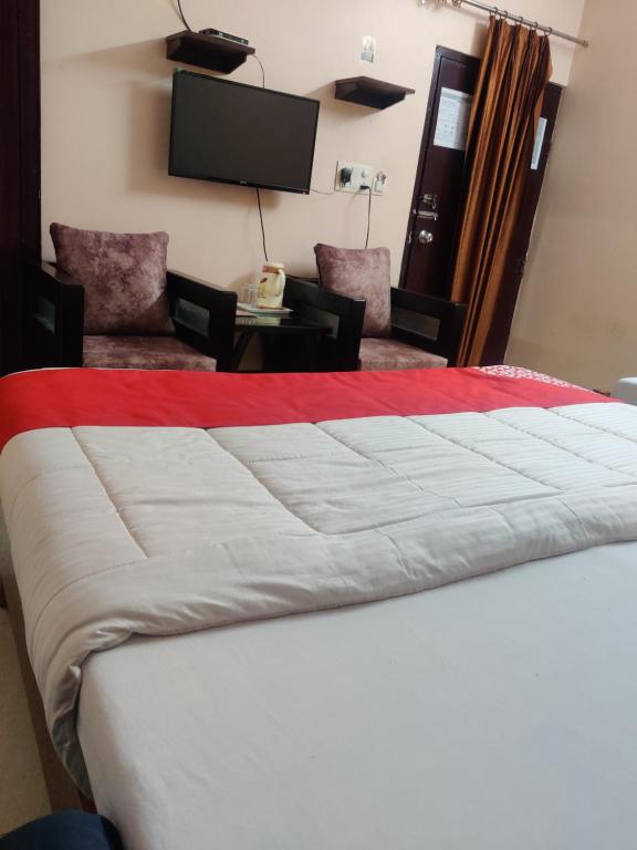 En eller flere senge i et værelse på Hotel Aarjee Crescent Jaipur