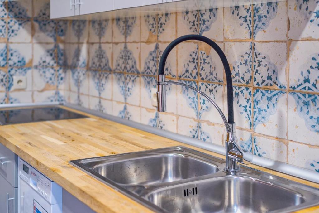 Kuchyň nebo kuchyňský kout v ubytování Mosaiko 5 Suites