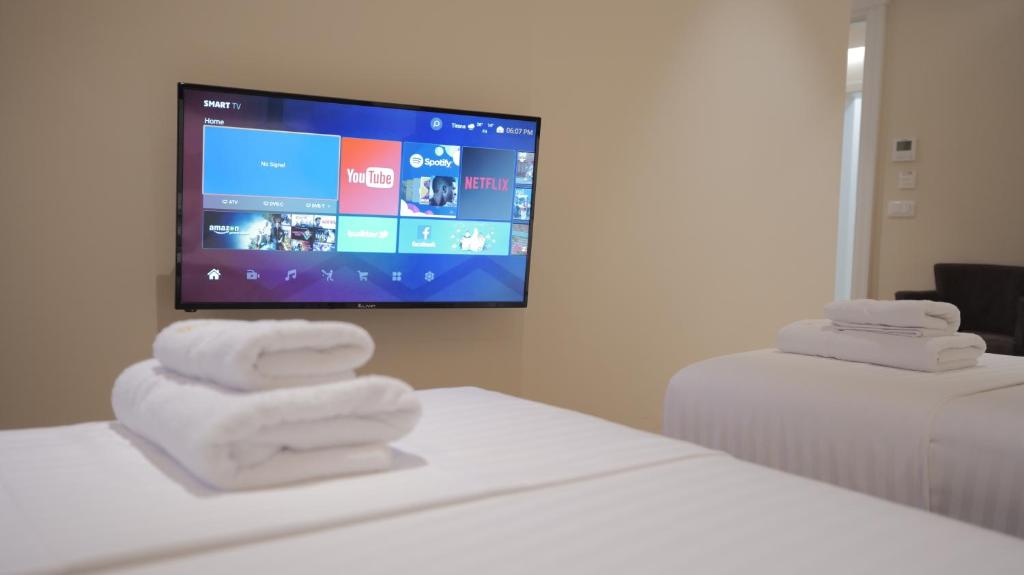 Llit o llits en una habitació de Granda Hotel