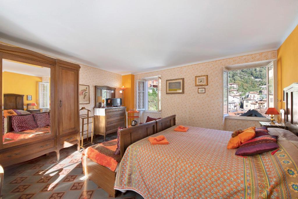 Ένα ή περισσότερα κρεβάτια σε δωμάτιο στο Il Mulino di Marina - Lake Como