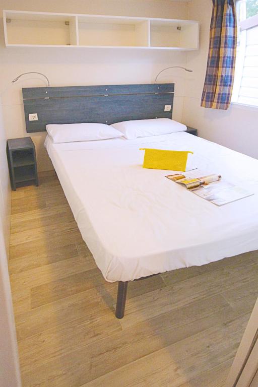 Postel nebo postele na pokoji v ubytování Happy Camp Mobile Homes in Camping Terme Čatež