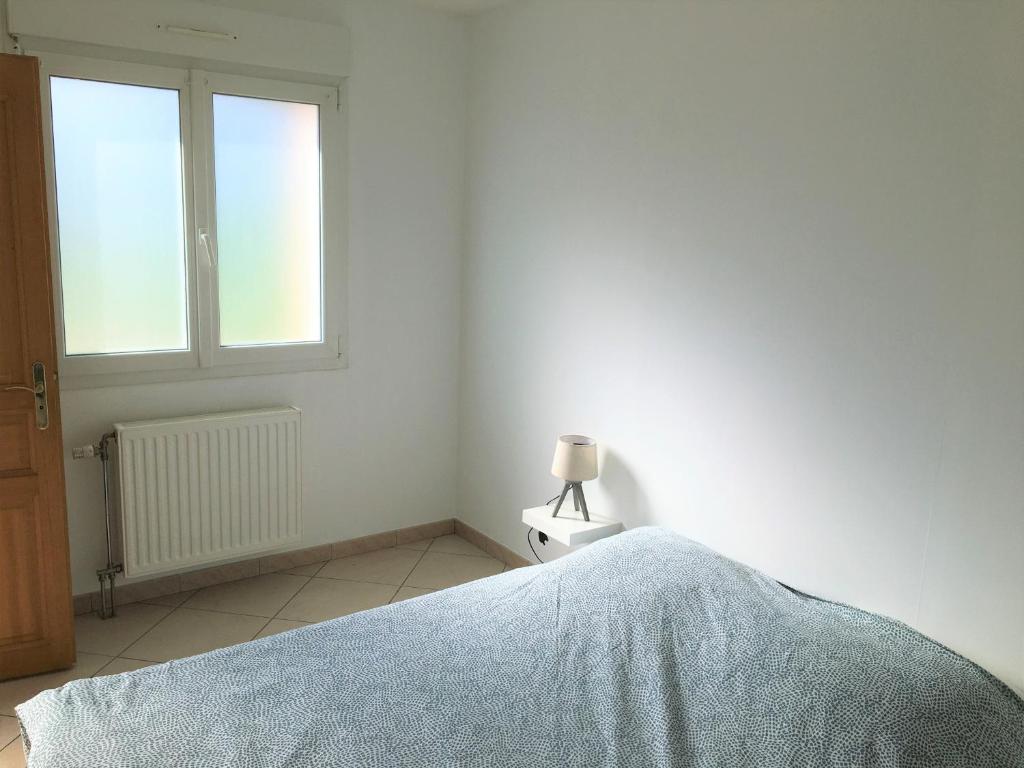 Postel nebo postele na pokoji v ubytování Gîte des Landes