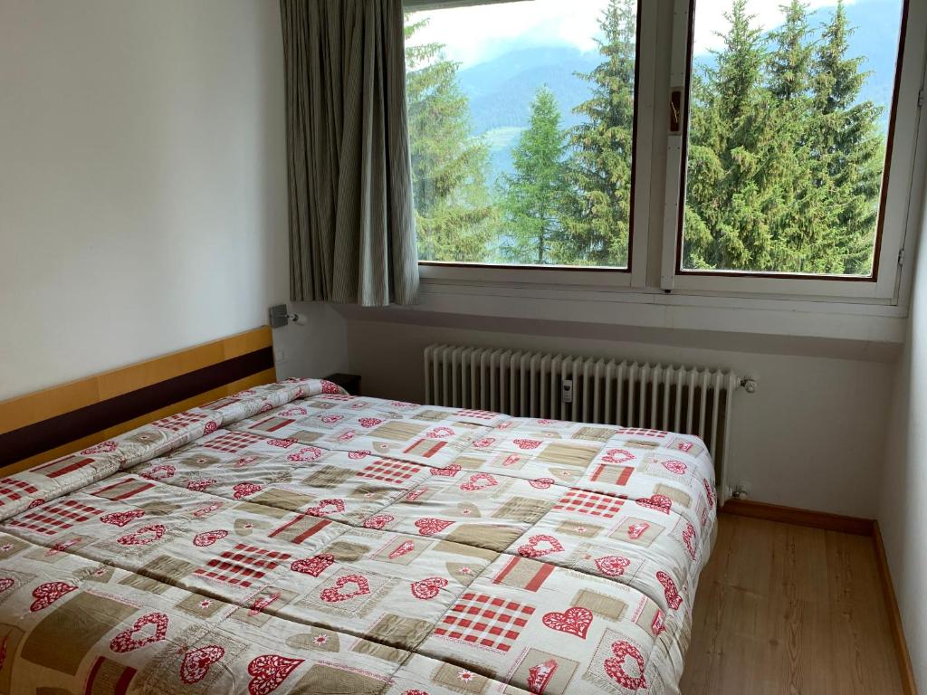 Postel nebo postele na pokoji v ubytování Residence Copai