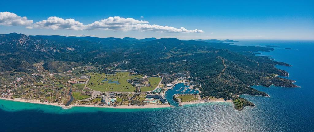 an aerial view of an island in the ocean at Porto Carras Meliton in Neos Marmaras