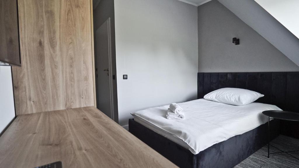 Posteľ alebo postele v izbe v ubytovaní Hotel Made in Napoli by Siervo Międzybórz