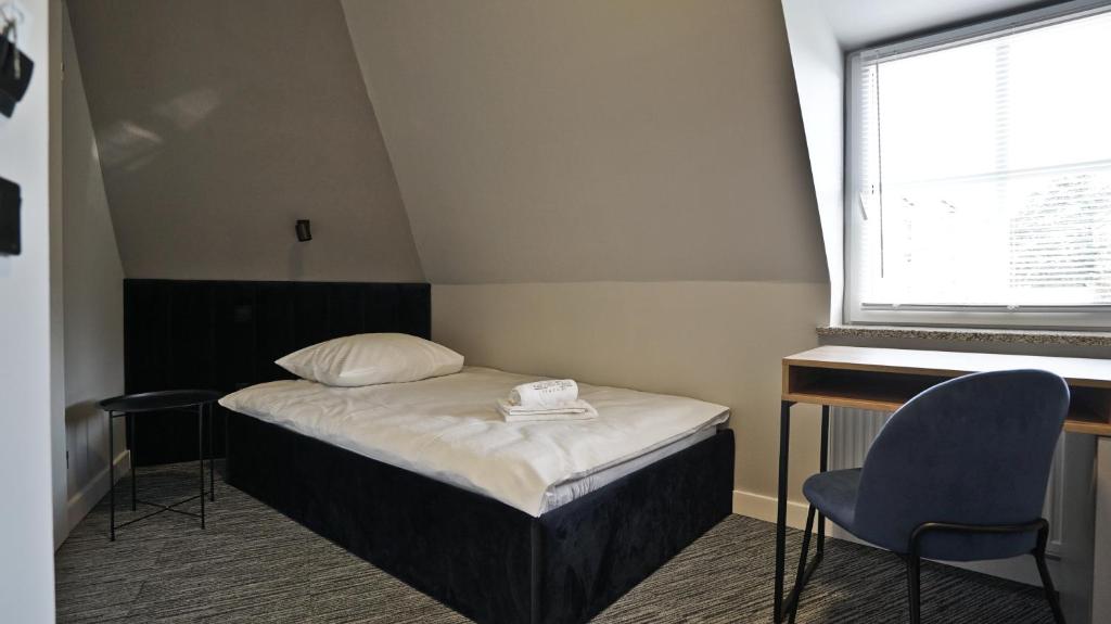 Posteľ alebo postele v izbe v ubytovaní Hotel Made in Napoli by Siervo Międzybórz