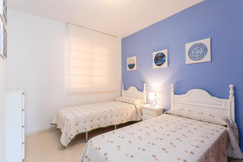 Łóżko lub łóżka w pokoju w obiekcie Apartamento El Recreo Torrox by Solset