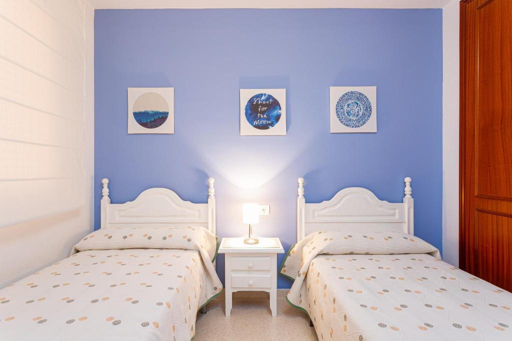 Łóżko lub łóżka w pokoju w obiekcie Apartamento El Recreo Torrox by Solset