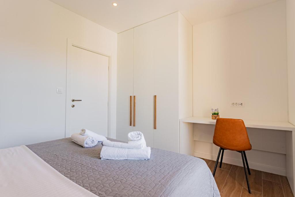 Posteľ alebo postele v izbe v ubytovaní Apartmani Benzon