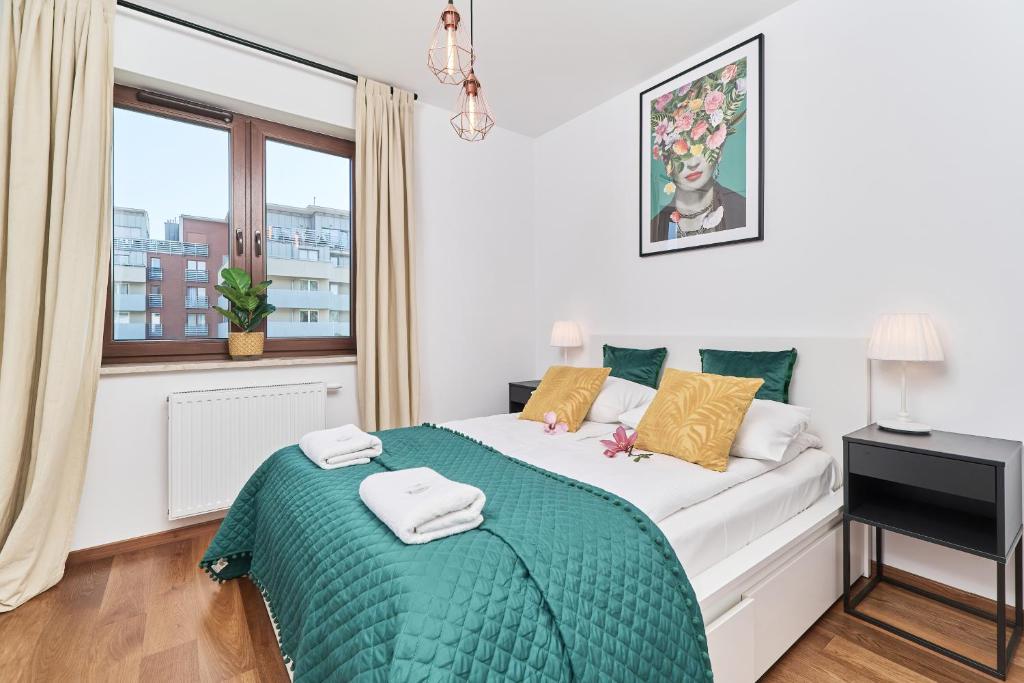 Posteľ alebo postele v izbe v ubytovaní Nowa Tęczowa Apartments Promenada Staromiejska by Noclegi Renters