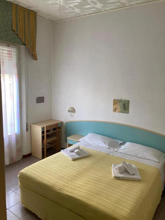 Postel nebo postele na pokoji v ubytování Hotel Villa Sorci