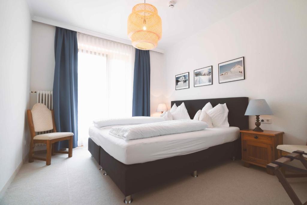 Postel nebo postele na pokoji v ubytování Hotel Berghof