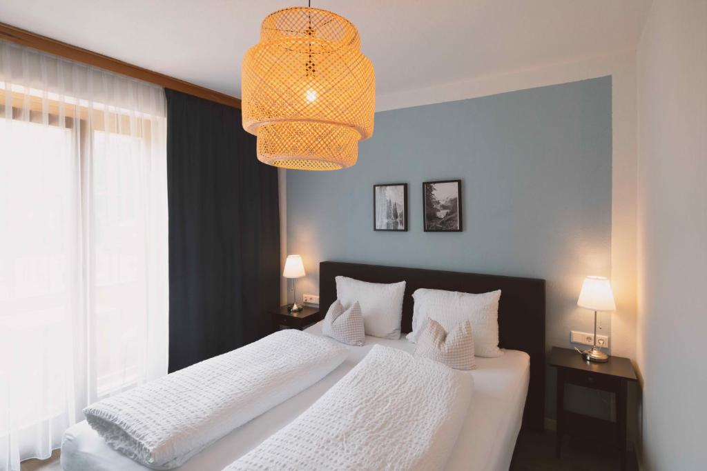 Postel nebo postele na pokoji v ubytování Hotel Berghof