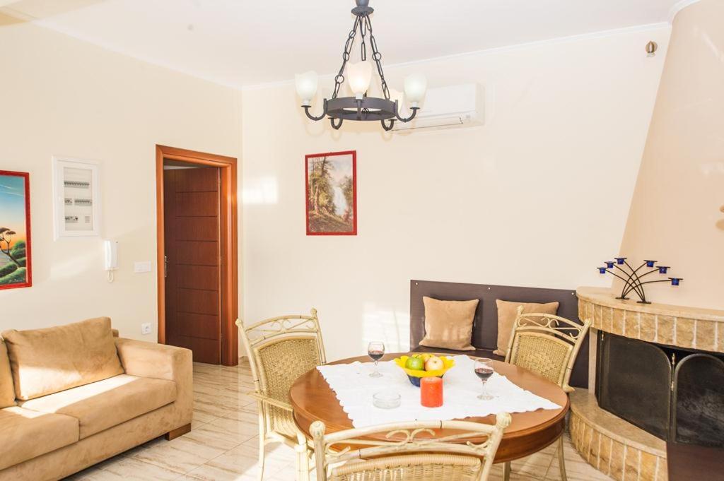 A seating area at Cozy flats in an olive grove by the sandy beach