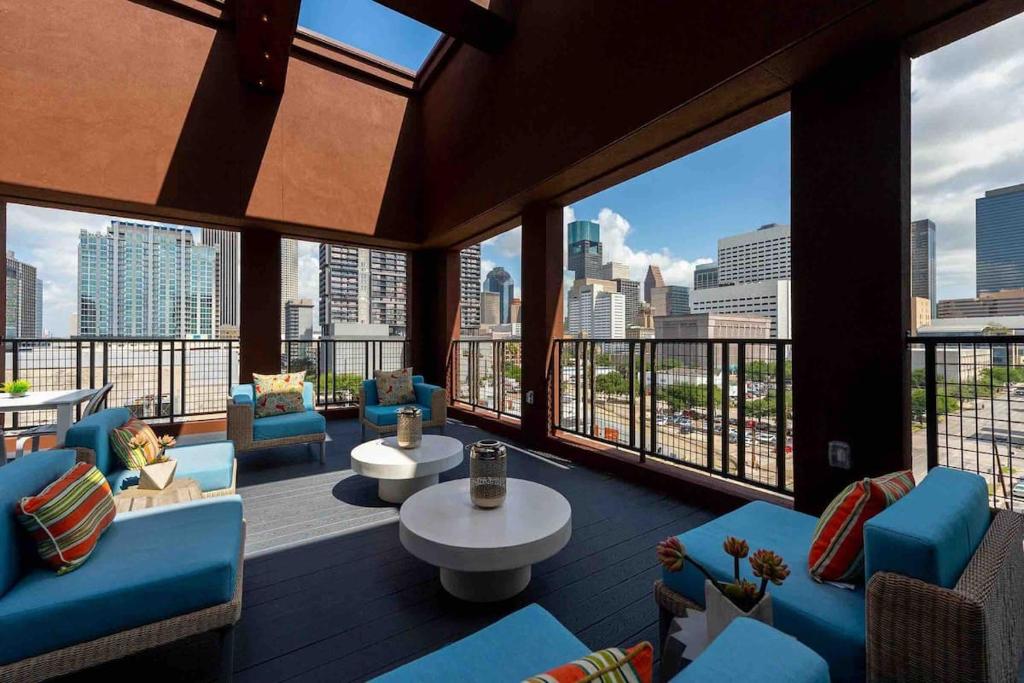 a large room with a view of a city skyline at Downtown Houston Condo w Pool and Free Parking 6 in Houston