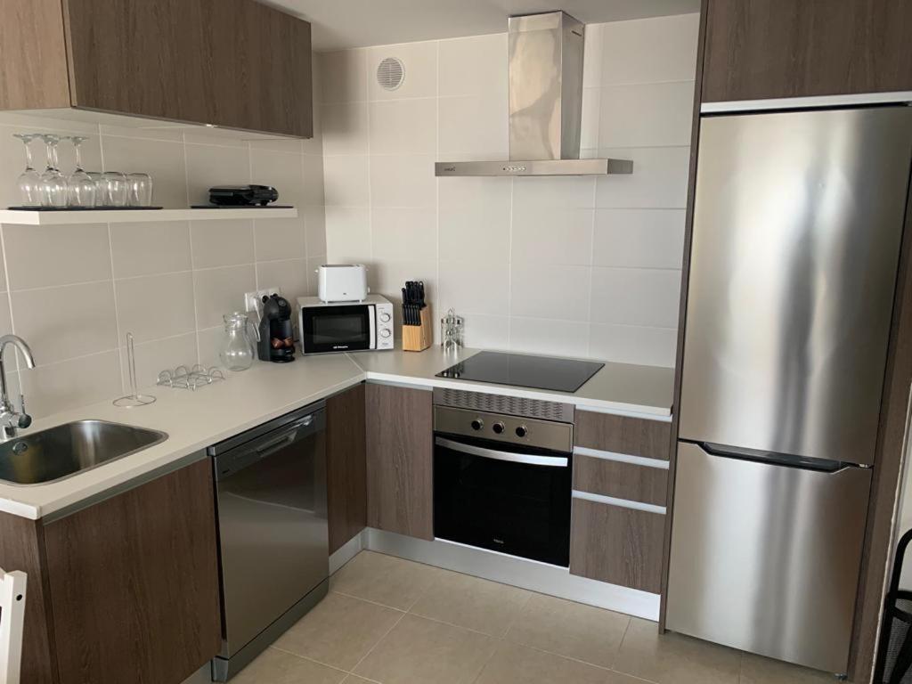 Kuchyň nebo kuchyňský kout v ubytování Apartamentos LAMAROSA -PLAYA URBANA