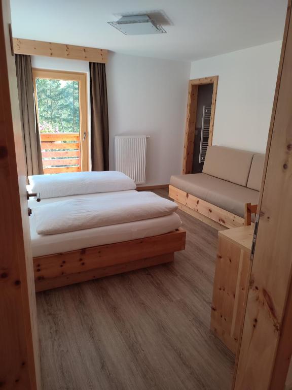 Postel nebo postele na pokoji v ubytování Apartments B&B Pretermo