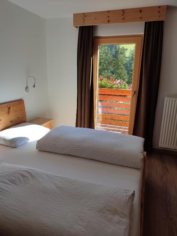 Postel nebo postele na pokoji v ubytování Apartments B&B Pretermo
