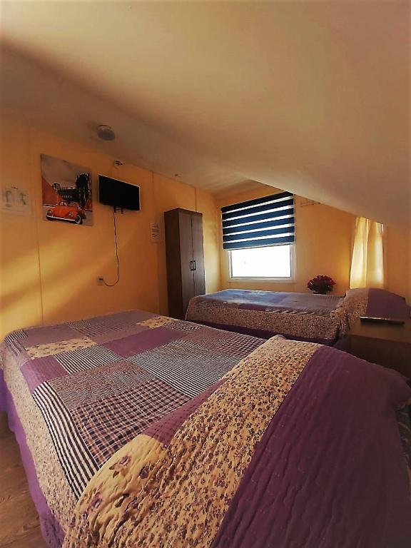 Postel nebo postele na pokoji v ubytování Hostal Del Tuto