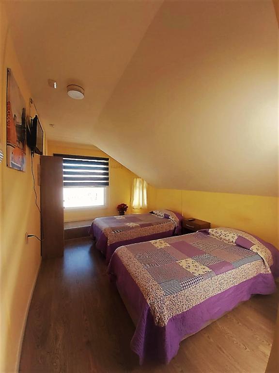 Postel nebo postele na pokoji v ubytování Hostal Del Tuto