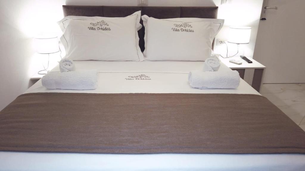 Letto o letti in una camera di Villa Orkidea