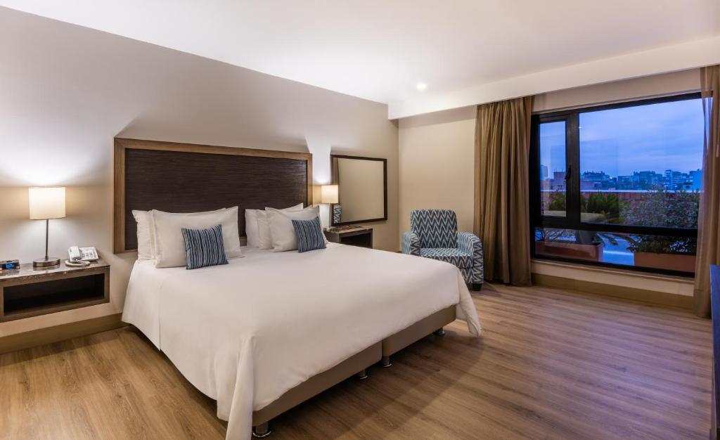 Postel nebo postele na pokoji v ubytování Hotel Morrison Zona Rosa