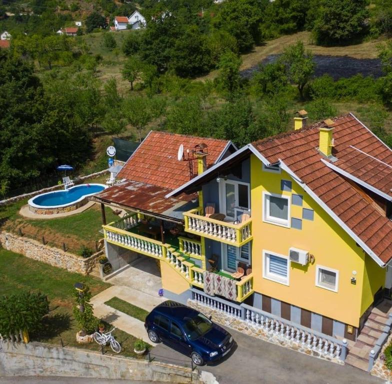 an aerial view of a house with a pool at Pansion Renata in Prozor
