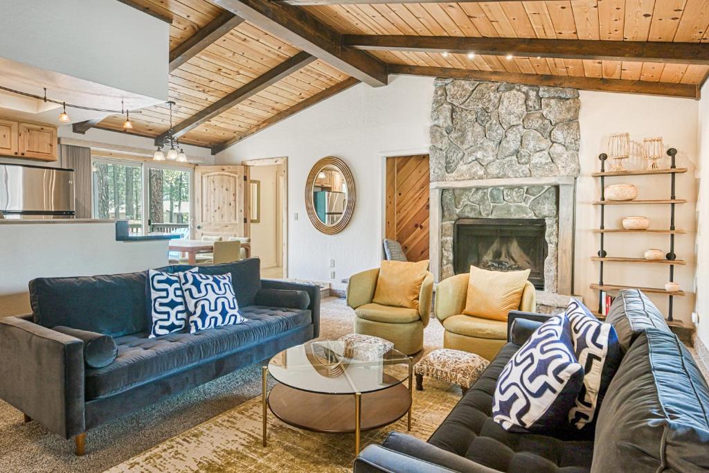 a living room with couches and a fireplace at The Hillside Retreat in South Lake Tahoe