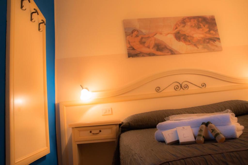 Postel nebo postele na pokoji v ubytování Hotel La Terrazza