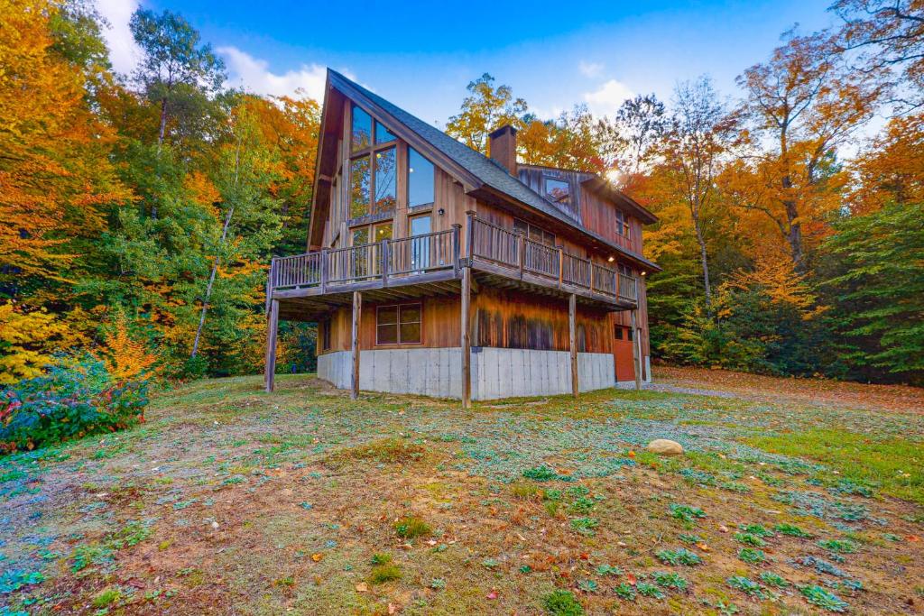 a large house in the middle of a field at Tuckerman Tollhouse in Jackson